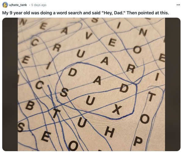 Screenshot of a Reddit post that says: 'My 9 year old was doing a word search and said, "Hey, Dad." Then pointed to this.' Attached is a photo of a word search with the phrase 'DAD SUX' circled.