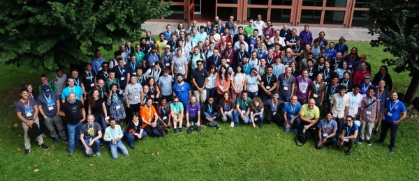 The group photo from Akademy 2019, showing a cross section of the community meeting in Milan, Italy.