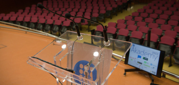 An empty lectern on the stage of Akademy 2022 in Barcelona.